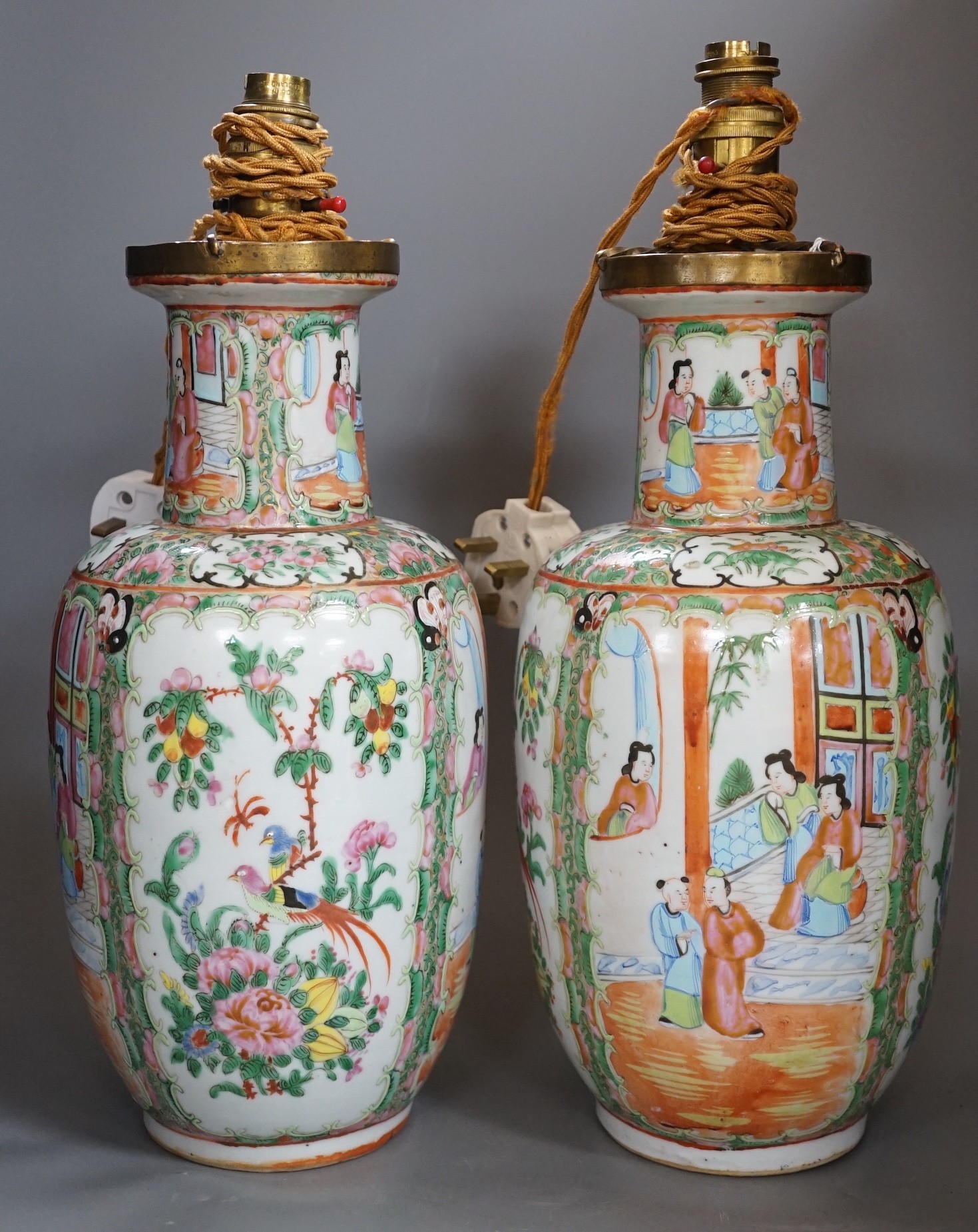 A pair of Chinese Canton famille rose vases, late 19th century, mounted as lamps, total height 43cm